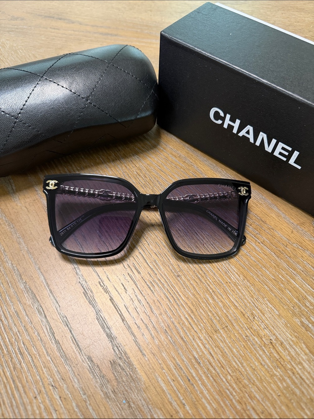 CHANEL Black Frame Sunglasses with Purple Gradient Lenses